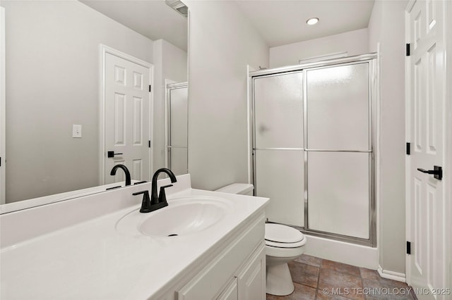 13041 E 67th St, Broken Arrow, OK 74012 - full bathroom featuring toilet, vanity, a shower stall, recessed lighting, and stone finish floors