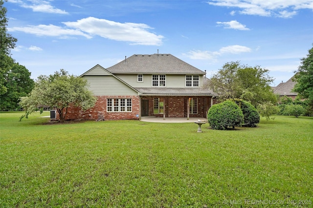 13041 E 67th St, Broken Arrow, OK 74012 - rear view of house featuring a patio area, a yard, brick siding, and a shingled roof