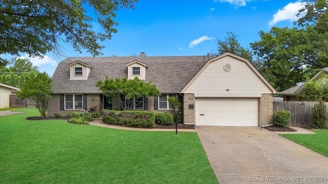 4812 S Knoxville Ave, Tulsa, OK 74135 - colonial inspired home featuring brick siding, concrete driveway, an attached garage, and a shingled roof