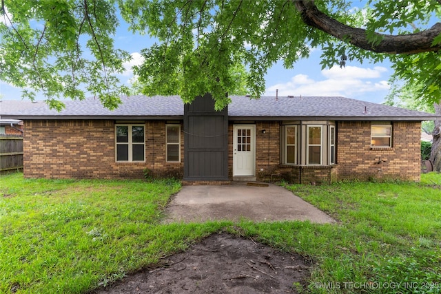 901 S Lions Ave, Broken Arrow, OK 74012 - view of front of house featuring brick siding, a shingled roof, and a patio