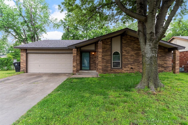 901 S Lions Ave, Broken Arrow, OK 74012 - mid-century home featuring an attached garage, a front yard, concrete driveway, and brick siding
