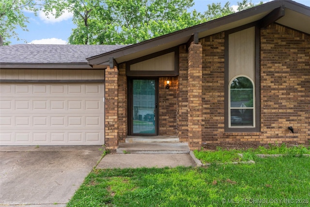 901 S Lions Ave, Broken Arrow, OK 74012 - entrance to property with concrete driveway, a garage, brick siding, and a shingled roof
