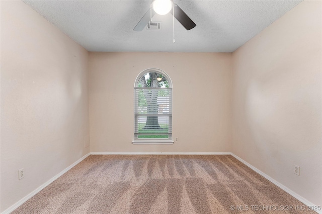 901 S Lions Ave, Broken Arrow, OK 74012 - empty room with a ceiling fan, carpet, a textured ceiling, and baseboards