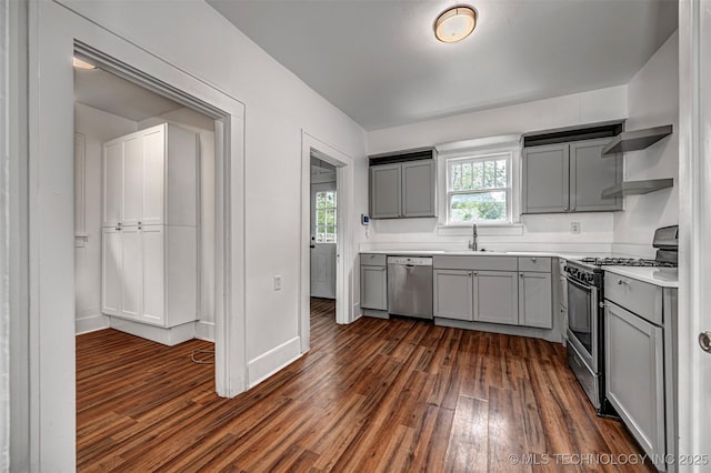 316 K St SW, Ardmore, OK 73401 - kitchen with gray cabinets, appliances with stainless steel finishes, dark wood finished floors, and open shelves