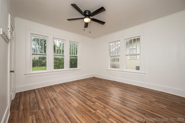 316 K St SW, Ardmore, OK 73401 - spare room featuring wood finished floors, baseboards, a ceiling fan, and ornamental molding
