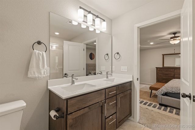 7506 E 87th Pl, Owasso, OK 74055 - full bath featuring ensuite bathroom, double vanity, a ceiling fan, and recessed lighting