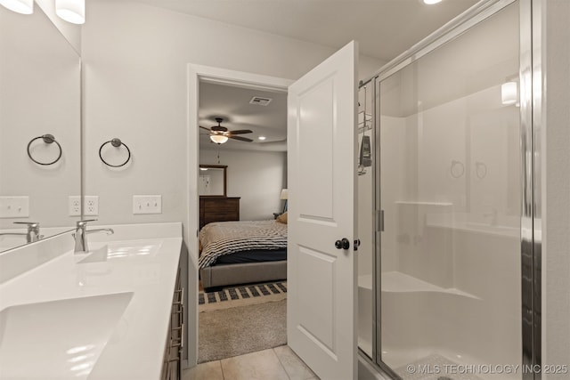 7506 E 87th Pl, Owasso, OK 74055 - ensuite bathroom featuring tile patterned floors, a shower stall, double vanity, ceiling fan, and recessed lighting