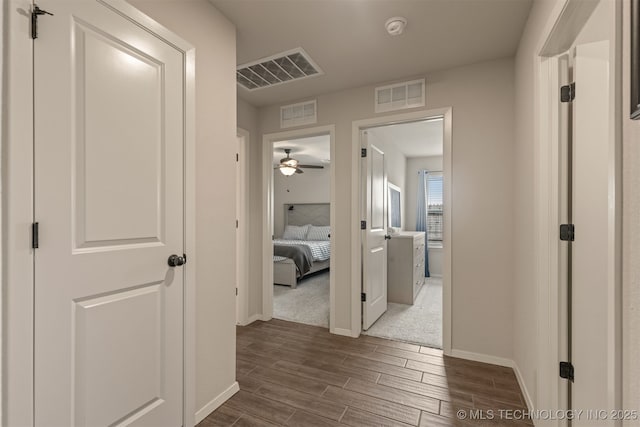 7506 E 87th Pl, Owasso, OK 74055 - corridor featuring dark wood-style floors and baseboards