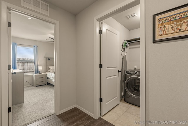 7506 E 87th Pl, Owasso, OK 74055 - laundry area with washer / clothes dryer and wood finished floors