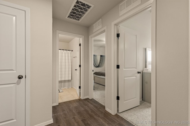 7506 E 87th Pl, Owasso, OK 74055 - hallway with dark wood finished floors and baseboards