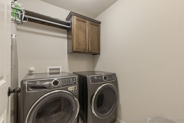7506 E 87th Pl, Owasso, OK 74055 - laundry room featuring washing machine and clothes dryer and cabinet space