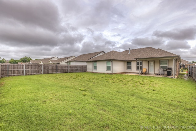 7506 E 87th Pl, Owasso, OK 74055 - back of property with a fenced backyard and a patio area