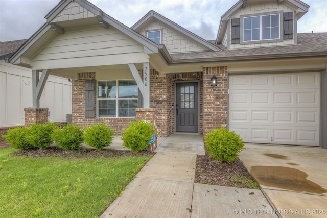 7506 E 87th Pl, Owasso, OK 74055 - craftsman inspired home with covered porch, brick siding, a shingled roof, concrete driveway, and a front yard