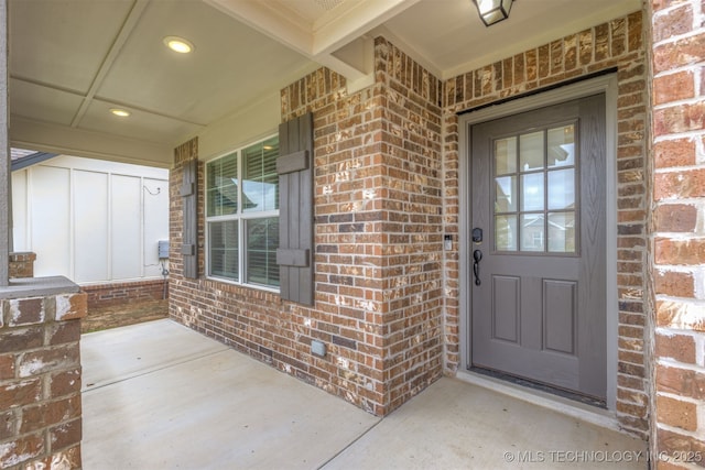 7506 E 87th Pl, Owasso, OK 74055 - entrance to property featuring a porch and brick siding