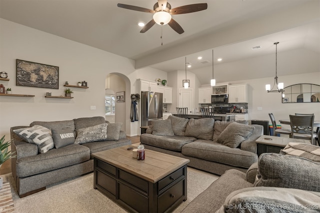 7506 E 87th Pl, Owasso, OK 74055 - living area with a ceiling fan, arched walkways, lofted ceiling, recessed lighting, and a chandelier