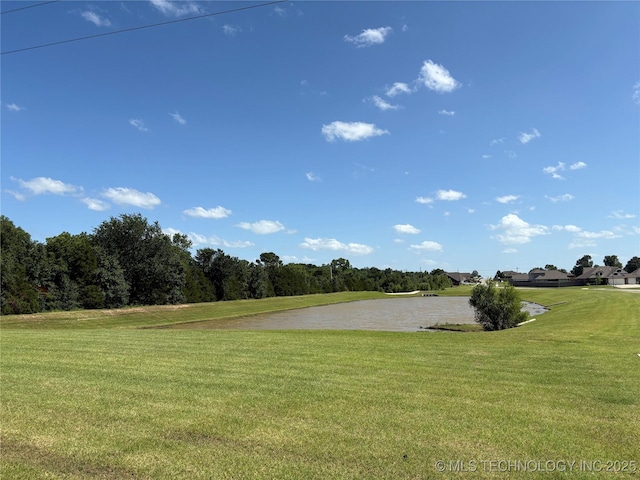 7506 E 87th Pl, Owasso, OK 74055 - view of home's community featuring a water view and a lawn