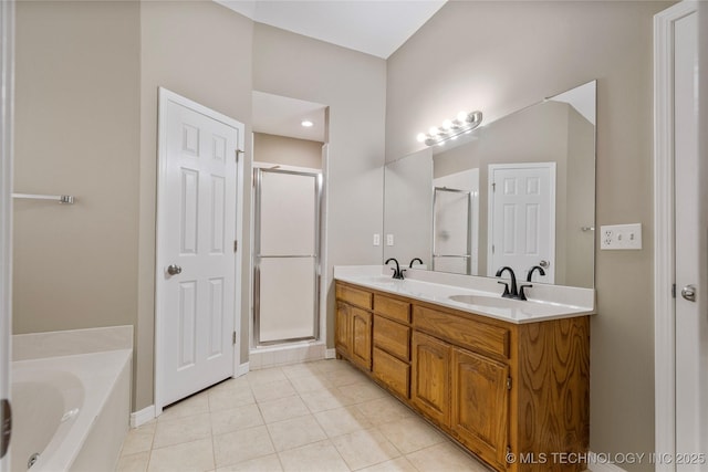 4309 W College St, Broken Arrow, OK 74012 - bathroom featuring a stall shower, a bath, double vanity, and tile patterned flooring