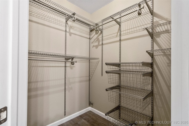 4309 W College St, Broken Arrow, OK 74012 - walk in closet featuring wood finished floors