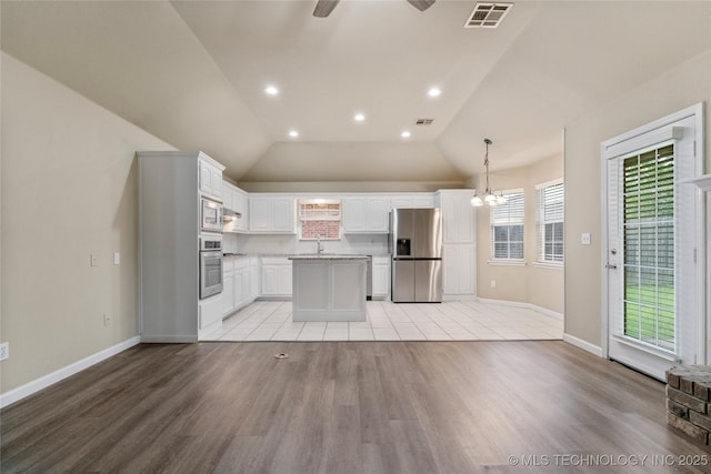 4309 W College St, Broken Arrow, OK 74012 - kitchen with stainless steel appliances, white cabinets, light wood-type flooring, ceiling fan, and recessed lighting