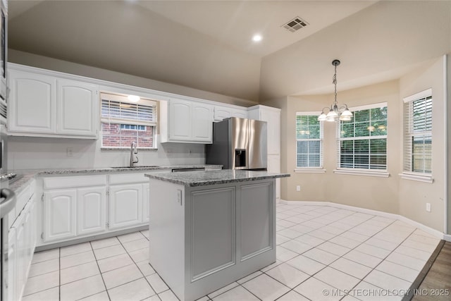 4309 W College St, Broken Arrow, OK 74012 - kitchen featuring a sink, stainless steel fridge, lofted ceiling, a chandelier, and light tile patterned floors