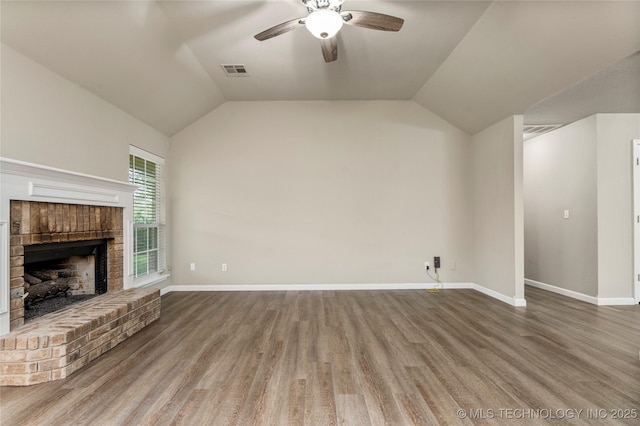 4309 W College St, Broken Arrow, OK 74012 - unfurnished living room with a ceiling fan, a brick fireplace, wood finished floors, baseboards, and lofted ceiling