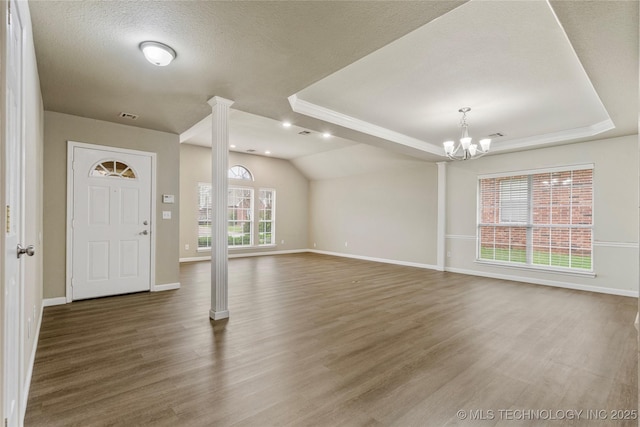 4309 W College St, Broken Arrow, OK 74012 - entryway with ornate columns, a chandelier, baseboards, a tray ceiling, and recessed lighting