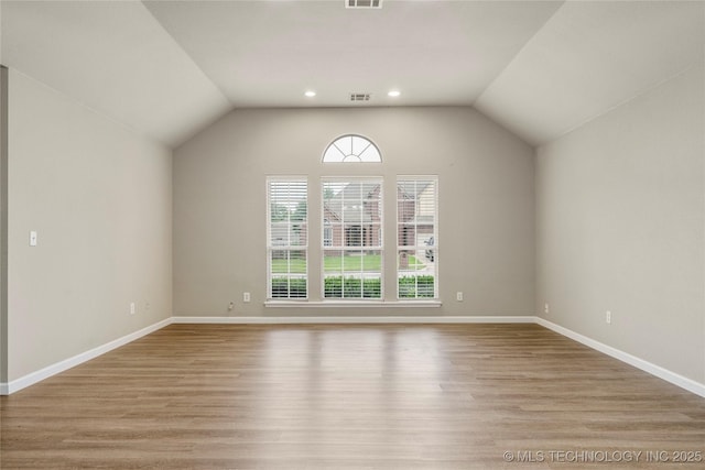4309 W College St, Broken Arrow, OK 74012 - unfurnished room featuring wood finished floors, recessed lighting, baseboards, and lofted ceiling