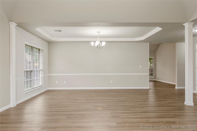 4309 W College St, Broken Arrow, OK 74012 - unfurnished room with a tray ceiling, healthy amount of natural light, wood finished floors, and ornamental molding