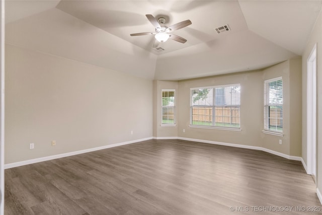 4309 W College St, Broken Arrow, OK 74012 - empty room featuring ceiling fan, wood finished floors, a raised ceiling, and baseboards