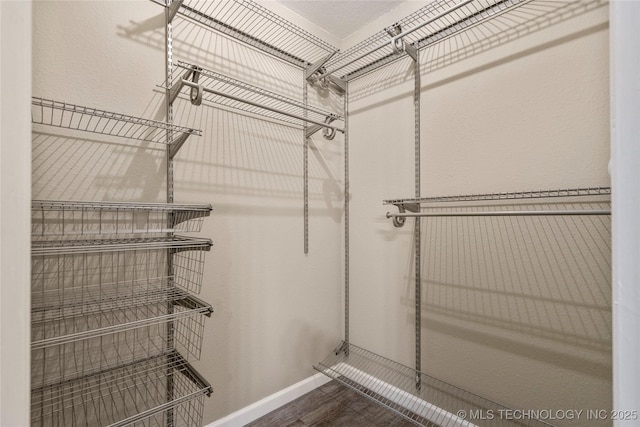 4309 W College St, Broken Arrow, OK 74012 - walk in closet featuring wood finished floors