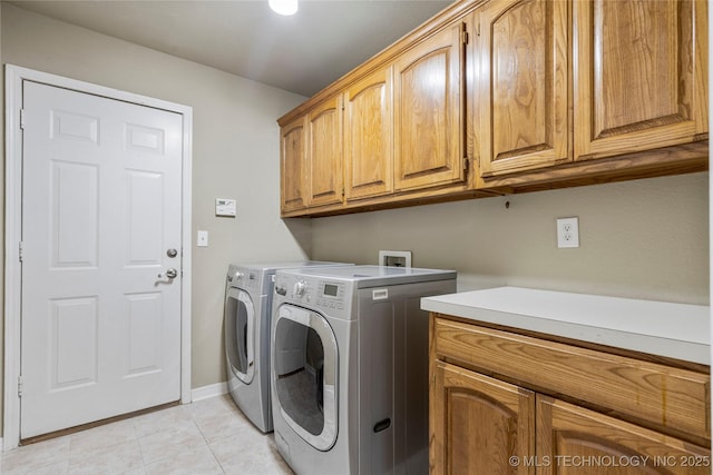 4309 W College St, Broken Arrow, OK 74012 - laundry room featuring cabinet space, independent washer and dryer, light tile patterned floors, and baseboards
