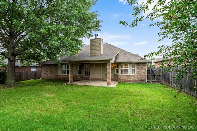 4309 W College St, Broken Arrow, OK 74012 - back of property featuring a patio area, a chimney, and brick siding
