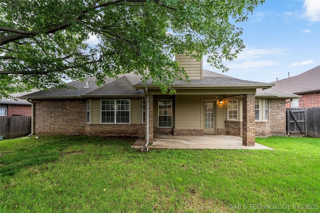 4309 W College St, Broken Arrow, OK 74012 - rear view of house featuring a patio area, brick siding, and a shingled roof