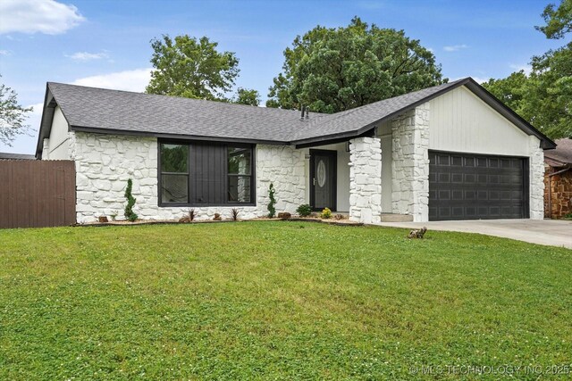 10128 E 34th St, Tulsa, OK 74146 - mid-century home featuring stone siding, an attached garage, a shingled roof, and driveway