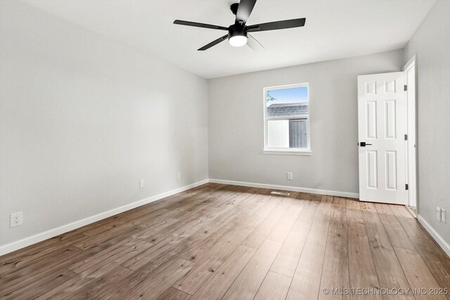 10128 E 34th St, Tulsa, OK 74146 - empty room featuring ceiling fan, baseboards, and wood finished floors
