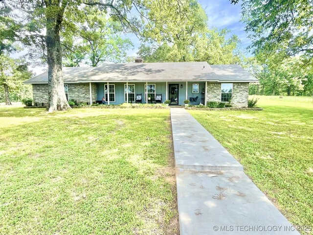 175 Johnson Rd, Broken Bow, OK 74728 - single story home with a porch, a front yard, stone siding, and a chimney