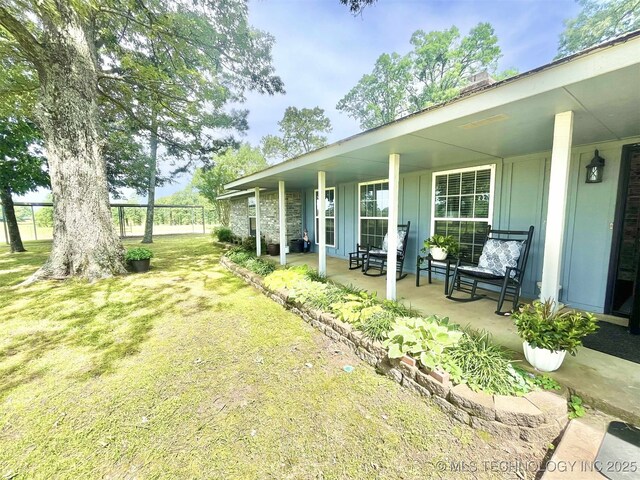 175 Johnson Rd, Broken Bow, OK 74728 - view of green lawn featuring covered porch