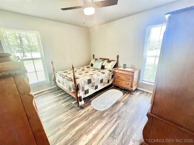 175 Johnson Rd, Broken Bow, OK 74728 - bedroom featuring wood finished floors, baseboards, and a ceiling fan