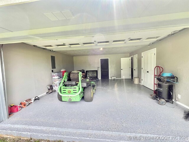 175 Johnson Rd, Broken Bow, OK 74728 - garage with baseboards and electric panel