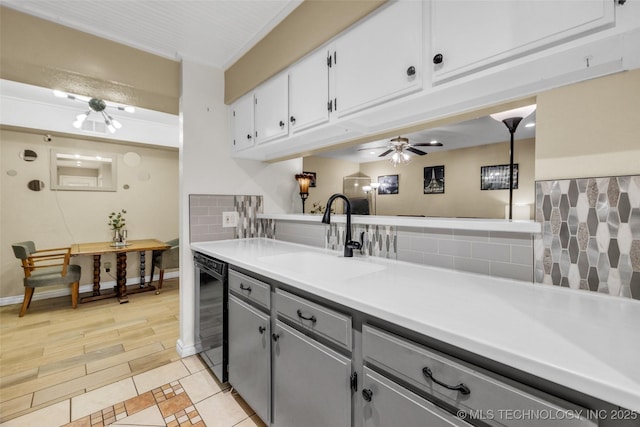 6356 S 80th E Ave Unit 25C, Tulsa, OK 74133 - kitchen with a sink, dishwasher, gray cabinetry, backsplash, and light countertops