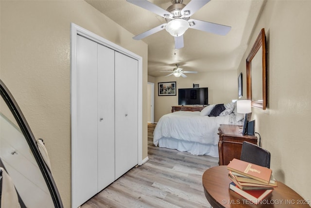 6356 S 80th E Ave Unit 25C, Tulsa, OK 74133 - bedroom featuring light wood finished floors, a closet, and ceiling fan
