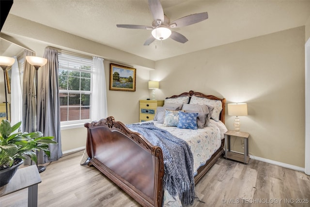 6356 S 80th E Ave Unit 25C, Tulsa, OK 74133 - bedroom featuring baseboards, wood finished floors, and ceiling fan