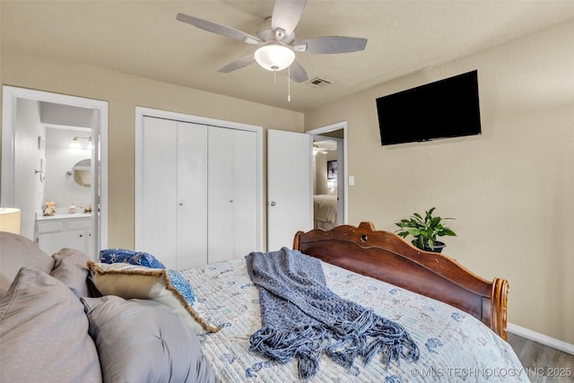 6356 S 80th E Ave Unit 25C, Tulsa, OK 74133 - bedroom with a closet, ensuite bath, wood finished floors, baseboards, and ceiling fan