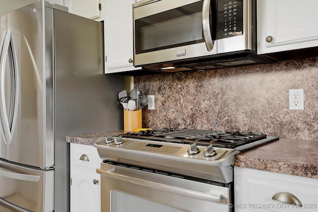 4407 W Lansing Pl, Broken Arrow, OK 74012 - kitchen with appliances with stainless steel finishes, white cabinetry, and tasteful backsplash