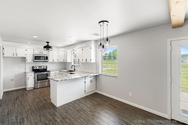 3160 E 406th Rd, Oologah, OK 74053 - kitchen featuring stainless steel appliances, a sink, a peninsula, white cabinetry, and recessed lighting
