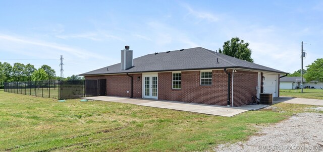 3160 E 406th Rd, Oologah, OK 74053 - rear view of property featuring a chimney, a patio, brick siding, french doors, and driveway