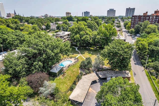 611 W 15th St Unit F1, Tulsa, OK 74127 - view of urban area with a pool area and a tree filled landscape