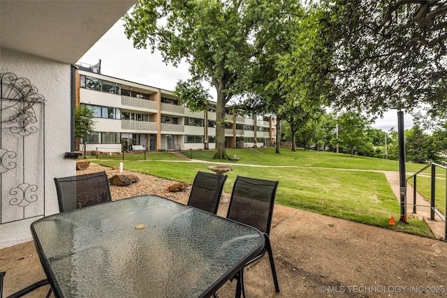 611 W 15th St Unit F1, Tulsa, OK 74127 - view of patio featuring outdoor dining area