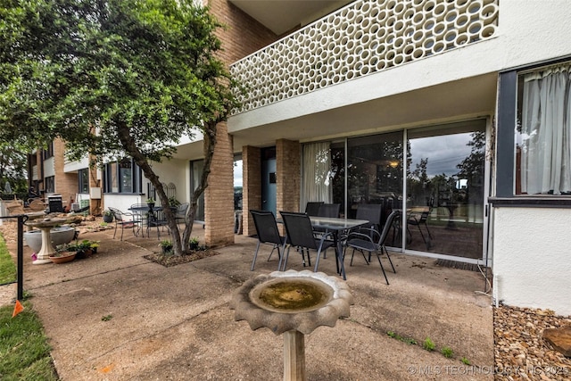 611 W 15th St Unit F1, Tulsa, OK 74127 - view of patio with outdoor dining space