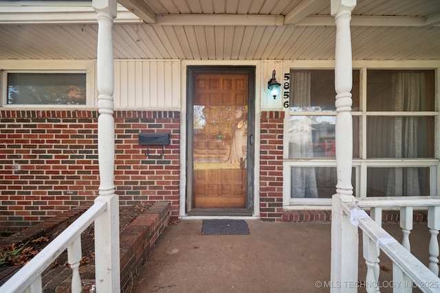 5856 E 22nd St, Tulsa, OK 74114 - entrance to property featuring brick siding and covered porch